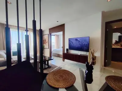 a large living room with a bed and a tv at Beautiful Apartment, Great Location, Fiber Optic in Casablanca