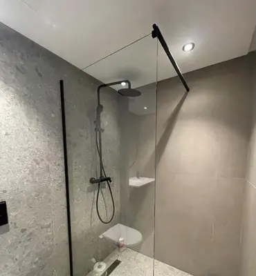 a bathroom with a shower with a glass door at Beautiful Apartment, Great Location, Fiber Optic in Casablanca