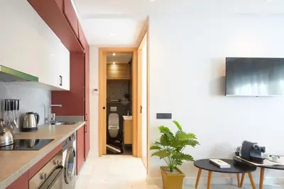 a kitchen with a sink and a toilet in a room at Beautiful 1 Bedroom in the Center of Casablanca in Casablanca