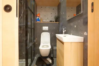 a bathroom with a white toilet and a sink at Beautiful 1 Bedroom in the Center of Casablanca in Casablanca