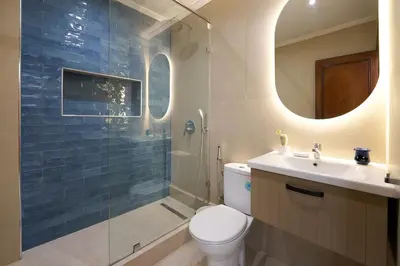 a bathroom with a toilet and a sink and a shower at 3 Bedrooms and Room Balcony in Central Casablanca in Casablanca