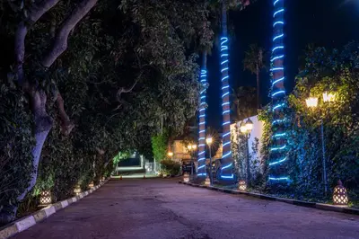 an empty street at night with blue lights at Casa Palma Morocco in Sidi Yahia az Zaʼer