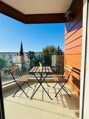 a table and chairs on a balcony with a view at Central 2 bedrooms in Casablanca in Casablanca