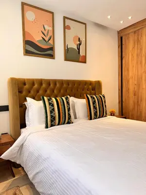 a bedroom with a large bed with white sheets at Central 2 bedrooms in Casablanca in Casablanca