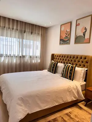 a bedroom with a large bed and a window at Central 2 bedrooms in Casablanca in Casablanca