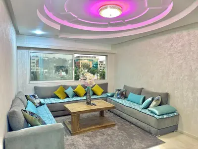 a living room with a couch and a purple ceiling at Spacious family accommodation in Rabat