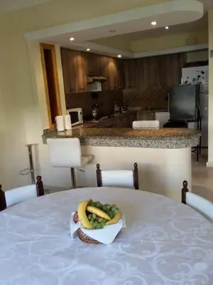 a plate of food sitting on top of a table at Magnificent Luxury Beach Villa in Savannah Beach in Dar Hamida
