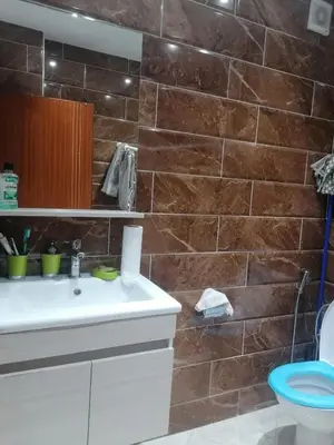 a bathroom with a sink and a toilet at 50m RDC aliace darna louizia in Mohammedia