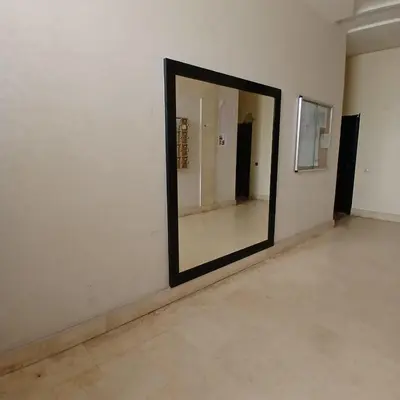a large mirror on a wall in a room at Residence Les jardins de Belvedere in Casablanca