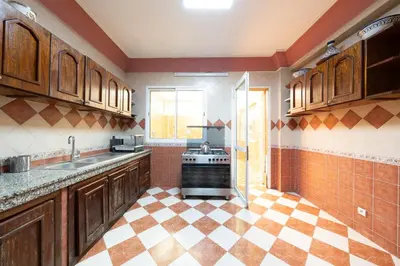 a kitchen with a sink and a stove at Large & Comfy 3 bedrooms in Casablanca Center in Casablanca