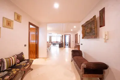 a living room with a couch and a table at Large & Comfy 3 bedrooms in Casablanca Center in Casablanca
