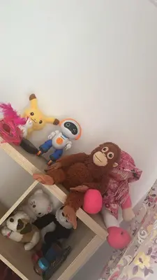 a bunch of stuffed animals sitting on a shelf at Appartement moderne à Bourgogne 2 chambre in Casablanca-Port