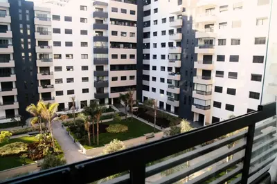 a view from the balcony of a building with tall buildings at Studio haut standing CASA in Aïn Harrouda