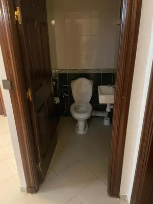a bathroom with a toilet and a sink at Chic Studio in Agdal Walk to Everything in Rabat