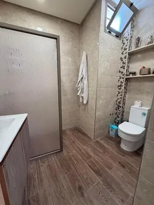 a bathroom with a toilet and a sink and a shower at Charmante Maison Traditionnelle au Cœur de la Médina, 5 min de Casa Port in Casablanca