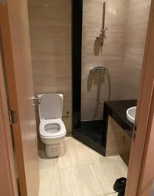 a bathroom with a toilet and a sink at Prestigia golf city bouskoura in Casablanca