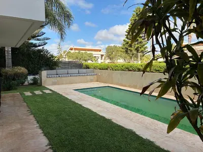 a swimming pool in the backyard of a house at Villa Bouznika Bay by Saloua in Bouznika