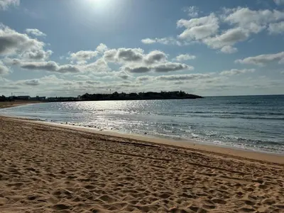 a sandy beach with the ocean and the sky at Villa Bouznika Bay by Saloua in Bouznika