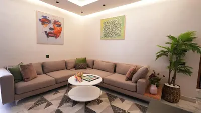 a living room with a couch and a table at Escapade Chic Gare - Oasis in Casablanca
