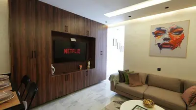 a living room with a couch and a flat screen tv at Escapade Chic Gare - Oasis in Casablanca