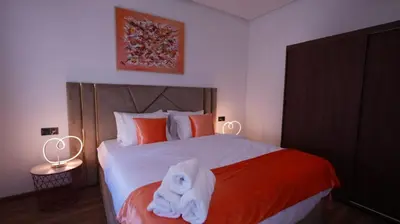 a bedroom with a bed with a towel on it at Escapade Chic Gare - Oasis in Casablanca