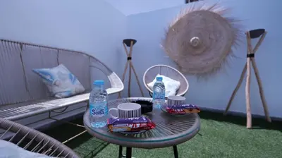 a table with two bottles of water on a patio at Escapade Chic Gare - Oasis in Casablanca
