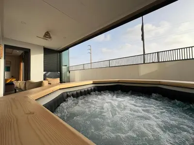 a hot tub in the middle of a house at Bain de soleil à Dar Bouazza in Dar Bouazza