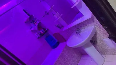 a pink bathroom with a toilet and a sink at Diar 4 in Casablanca