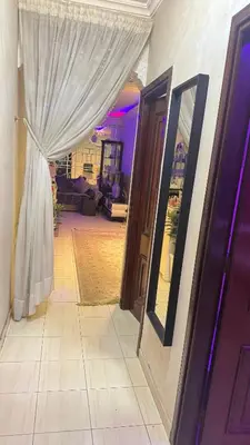 a doorway to a room with a wedding dress and a mirror at Diar 4 in Casablanca