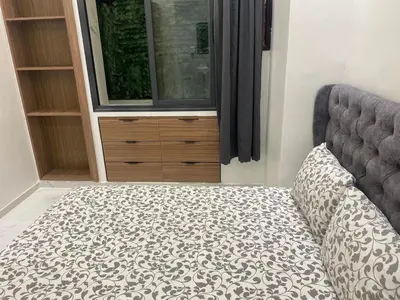 a bedroom with a bed and a dresser at Chic city center studio in Casablanca