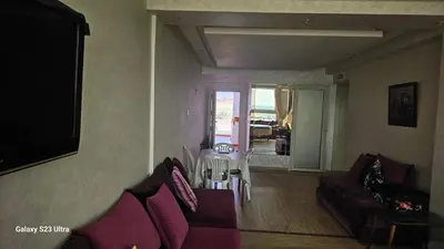 a living room with a couch and a table at Appartement de plage front de mer in Tamaris