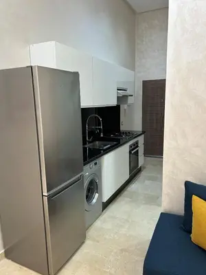 a kitchen with a stainless steel refrigerator and a dishwasher at Casa Chic Studio Apartment in Casablanca