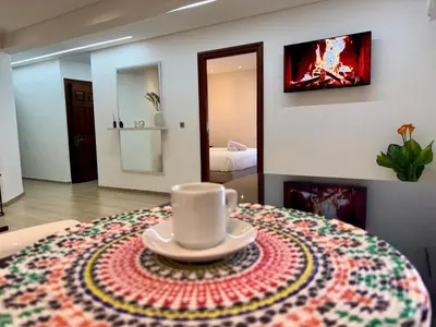 a coffee cup sitting on a table in a room at 2br near TGV station in Rabat