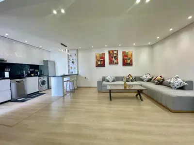 a living room with a couch and a table at 2br near TGV station in Rabat