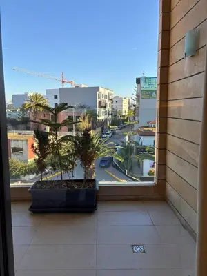 a view of a city street from a window at Appartement moderne avec équipements de luxe in Maarif
