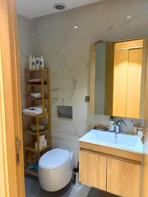 a bathroom with a toilet and a sink at Appartement moderne avec équipements de luxe in Maarif