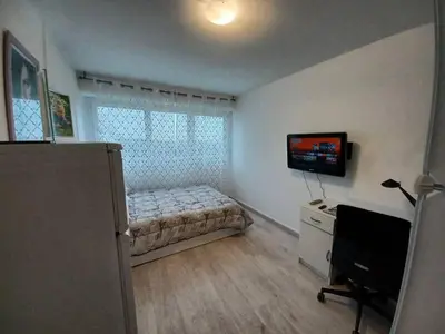 a bedroom with a bed and a television in it at Chic and Calm Flat in Heart of Casa in Casablanca