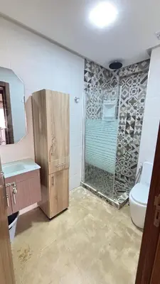 a bathroom with a shower and a toilet at Maison vacances Mansoria in Casablanca