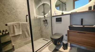 a bathroom with a shower and a toilet and a sink at Sunshine in Casablanca