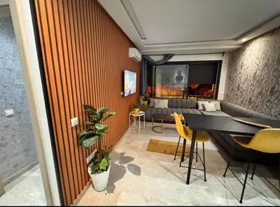 a living room with a table and chairs at Sunshine in Casablanca
