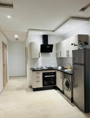 a kitchen with a stainless steel refrigerator and a dishwasher at Sunshine in Casablanca