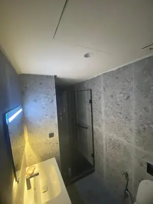 a bathroom with a shower and a white sink at The Quiet House in Casablanca