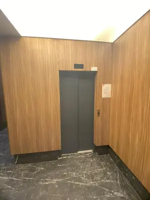 a elevator with a door in a room with wooden walls at The Quiet House in Casablanca