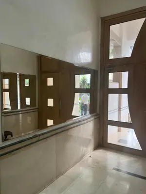 a bathroom with a large mirror and a window at Large bright and centrally located studio in Casablanca