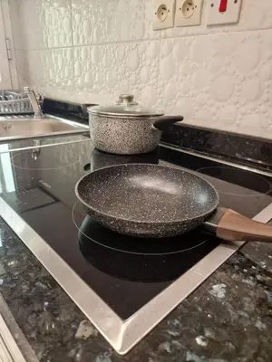 a pan sitting on top of a stove in a kitchen at Chez Maud Skhirat-Rabat in Skhirat