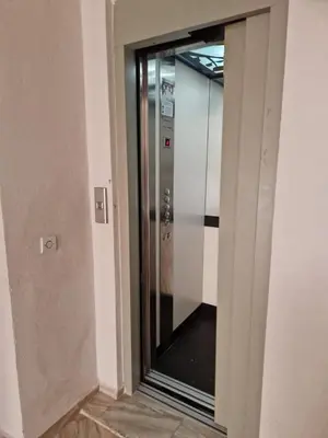 a elevator in a building with a glass door at Chez Maud Skhirat-Rabat in Skhirat