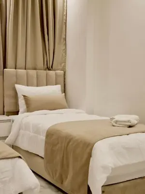 two beds sitting next to each other in a bedroom at Chez Maud Skhirat-Rabat in Skhirat