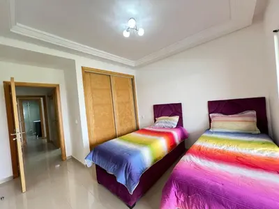 two beds sitting next to each other in a room at Ola Blanca in Sidi Rahal