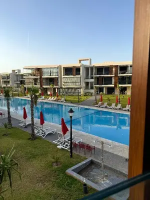 a view of a swimming pool in a hotel at Sidi Rahal Oceanic Appartement vue sur piscine in Sidi Rahal