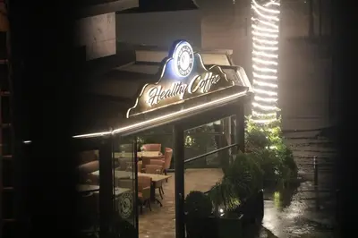 a restaurant with a neon sign on the front of it at Luxurious and modern studio on Maarif-Franceville in Casablanca